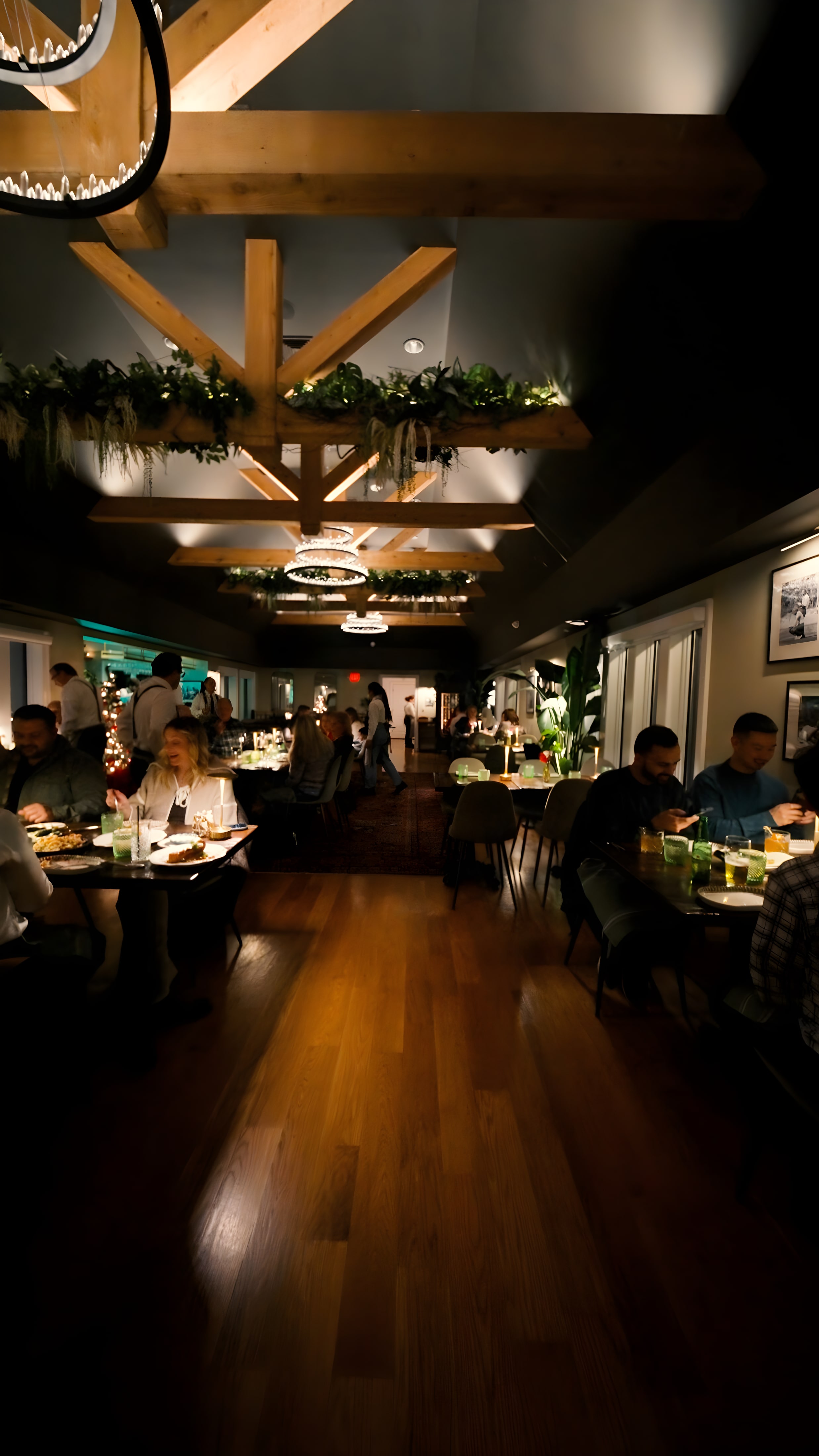 The warm, beamed dining room at Ember & Eagle