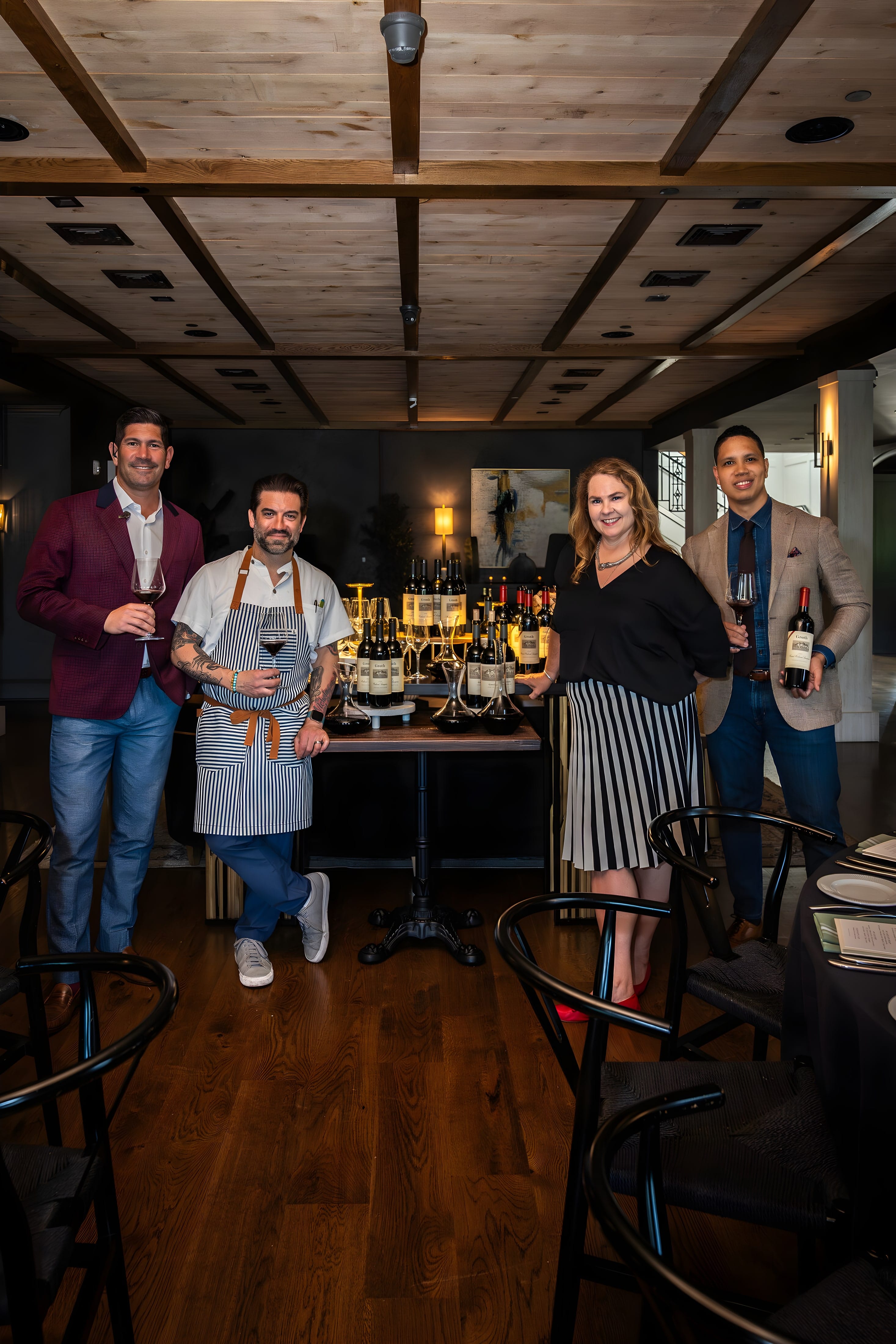 Guests gathered for a wine dinner at Ember & Eagle